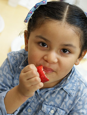 Kid Enjoying Strawberry